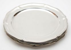 Ten Mexican Sterling silver dinner plates: of plain circular form with wavy edge borders,