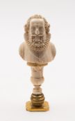A 19th century carved ivory desk seal: in the form of an Elizabethan gentleman with curly hair and