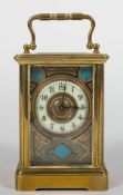 A French Edwardian carriage clock: the eight-day duration timepiece movement having a replaced