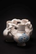 A London blue and white delftware fuddling cup: in the form of three globular cups with cylindrical