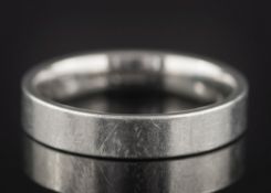 A platinum wedding band:, approximately 6.5gms.