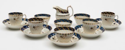 A Chamberlain's (Worcester) porcelain part tea service: of wrythen moulded form decorated in gold