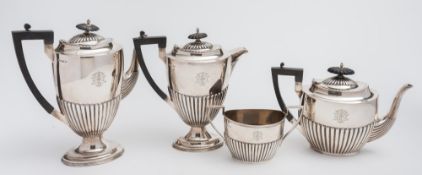 A George V silver four-piece part tea and coffee service, maker Walker and Hall Sheffield,