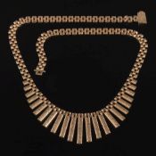 A 9ct gold fringe necklace: approximately 33.5gms gross weight.