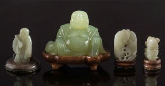 Three Chinese jade carvings and a hardstone figure of Budai: the first of two bean pods with