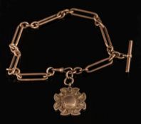 A gentleman's 9ct gold watch chain: with attached pendant medallion,