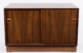 A Danish 'dyrlund' 1970's rosewood dwarf side cabinet:, enclosed by a pair of sliding doors,