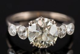 A diamond five-stone ring: the principal round old brilliant-cut diamond approximately 8.