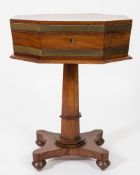 A Georgian mahogany and brass bound octagonal cellarette or work table:, on later polygonal column,