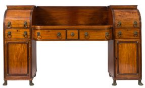 A Regency mahogany and ebony lined pedestal sideboard: of bowed breakfront outline,