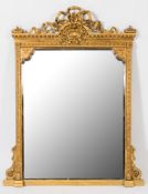 A Victorian carved giltwood and gesso overmantel mirror: with ribbon tied floral spray cresting,