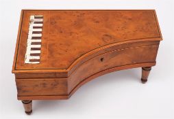 A figured bird's eye maple veneered musical box: in the form of a miniature grand piano,