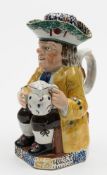A Portobello pottery Toby jug and cover: of traditional form with the toper holding a pipe and jug