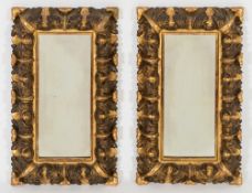 A pair of 19th century carved giltwood rectangular mirrors: of small size,