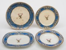 An English porcelain dinner service: enamelled with a displaying eagle and the motto 'Mente