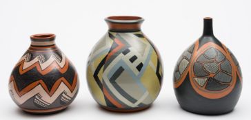 Three Harry Juniper Bideford Pottery terracotta vases: two of oviform with raised necks and one