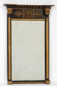 An early 19th century ebonised and giltwood and gesso pier mirror:,
