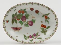 A Chelsea porcelain dish: of oval form with feather moulded rim enamelled in colours with figs,