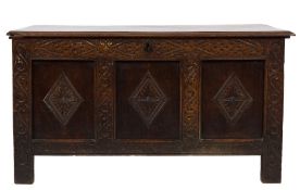 An early 18th century oak rectangular coffer: with a plain hinged moulded top,