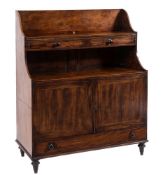 An unusual late George III mahogany and inlaid low graduated bookcase/writing desk:,