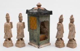 A Chinese pottery sedan chair and roof with four attendant figures: the chair decorated with green