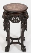 A Chinese carved hardwood circular jardiniere stand:, the top with a beaded edge,