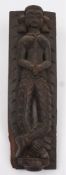 A 19th century central Indian wooden stile with carved figure: in traditional costume with