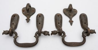 A set of 19th century Persian bronze door furniture: comprising two loop handles with clasps and