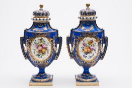 A pair of Minton porcelain two handled pedestal vases and covers: after Sèvres originals,