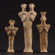 A group of three Syro/Hittite terracotta idol figures: comprising a double headed and two single