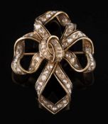 A 19th century enamelled gold and diamond mounted ribbon bow brooch:,