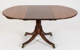 A 19th Century mahogany oval extending dining table:, in the Regency manner,