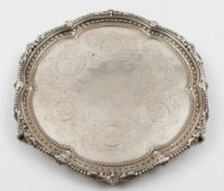 A Victorian silver waiter, maker Richard Martin & Ebenezer Hall, Sheffield, 1867: inscribed,