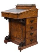A Victorian walnut davenport:,
