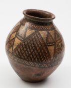 A Chinese Neolithic terracotta jar: of ovoid form with flared rim,