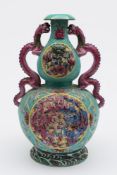 A Chinese double gourd pink dragon vase: with sinuous pink dragon handles with loose eyes,