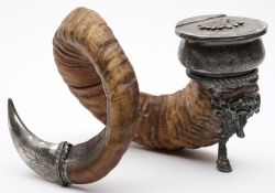 A ram's horn and electro-plate mounted inkwell: the circular well with hinged lid decorated with