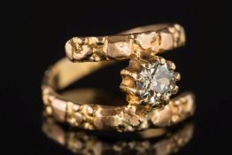 A diamond single-stone ring: the circular, old-cut diamond estimated to weigh 0.