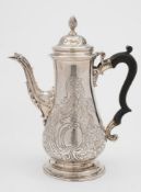 A George III silver coffee pot, maker Francis Crump, London, 1766: crested,