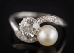 A pearl and diamond two-stone crossover ring: with a single pearl (untested) approximately 7.