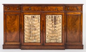 An early 19th century mahogany breakfront low side cupboard:,