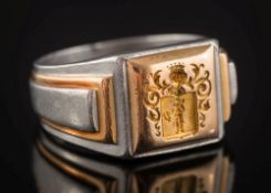 A French platinum and gold seal ring: with armorial intaglio, ring size W, 26.7gms gross weight.