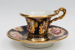 A miniature Coalport porcelain cabinet cup and saucer: the cup of flaring form with entwined