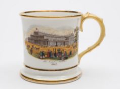 A Coalport porcelain commemorative 'frog' mug: of cylinder form with foliate moulded handle,