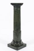 A green mottled marble cylindrical column: with a square moulded top,