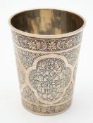An Indo-Persian white metal beaker : of cylindrical form,