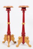 A pair of Victorian cast iron and later painted torcheres:,