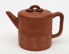 A Chinese Yixing teapot, liner and cover: of barrel shaped form,