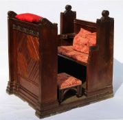 By Direction of Sidmouth Parish Church A Late Victorian Verger's carved oak stall: with foliate,