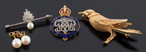 An 18ct gold and diamond mounted 'bird' brooch:,